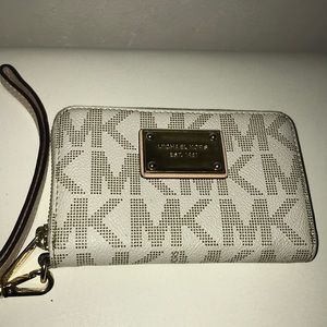 Authentic Michael Kors wallet with a wrist strap